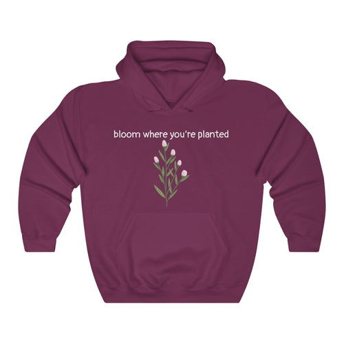 Maroon Flourished Hoodie front side with text and pinky bud flower. 