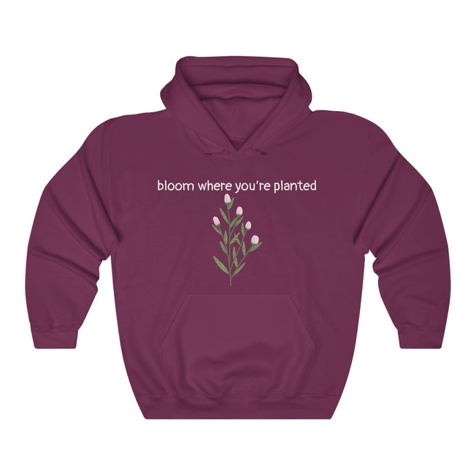 Maroon Flourished Hoodie front side with text and pinky bud flower. 