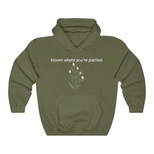 Load image into Gallery viewer, Military green Flourished Hoodie front side with text and pinky bud flower.
