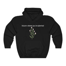 Load image into Gallery viewer, Black Flourished Hoodie front side with text and pinky bud flower. 
