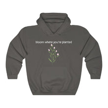 Load image into Gallery viewer, Charcoal Flourished Hoodie front side with text and pinky bud flower. 
